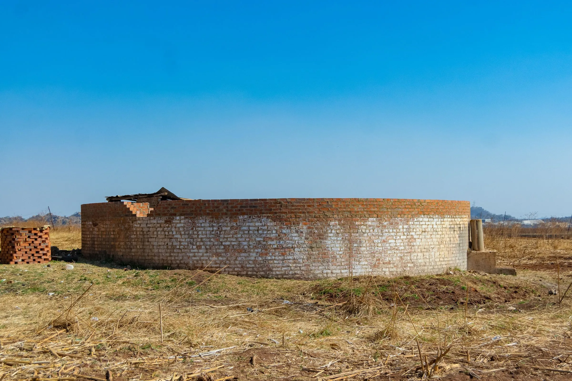 Water storage reservoir under construction, photographed 25 Aug 2026